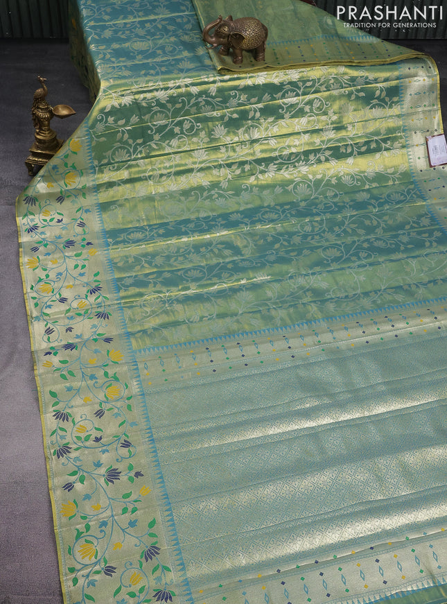 Tissue paithani saree dual shade of teal blue with allover floral zari weaves and zari woven paithani style border