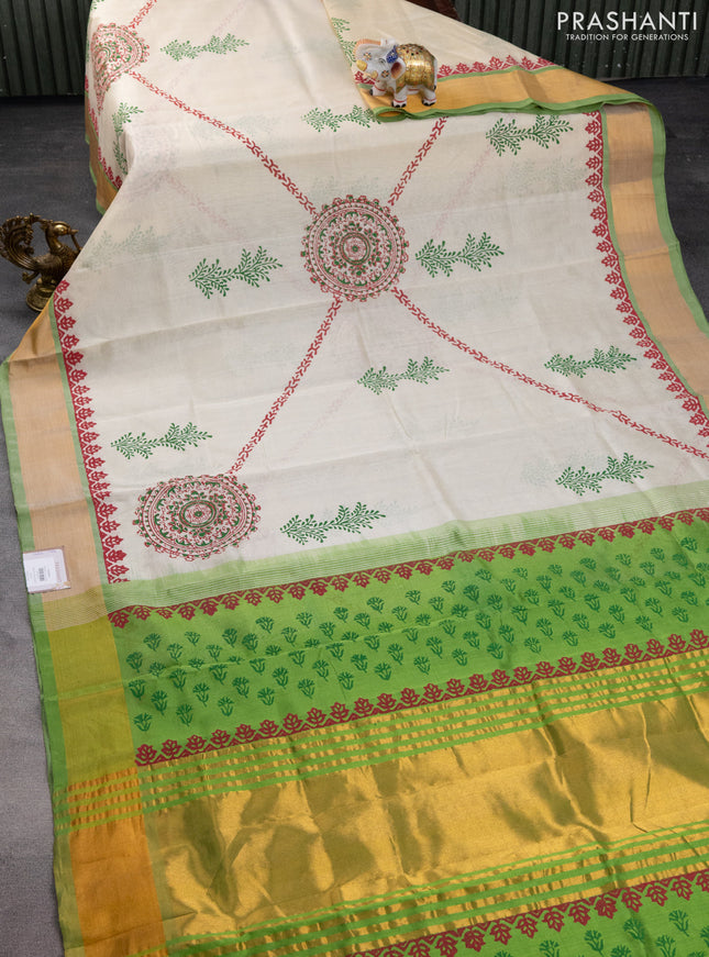 Silk cotton block printed saree cream and light green with allover prints and zari woven border