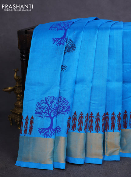 Silk cotton block printed saree light blue with allover prints and zari woven border