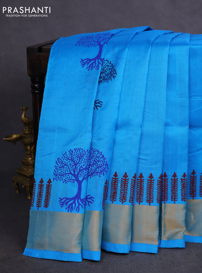 Silk cotton block printed saree light blue with allover prints and zari woven border