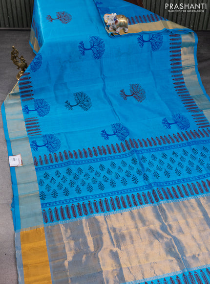 Silk cotton block printed saree light blue with allover prints and zari woven border