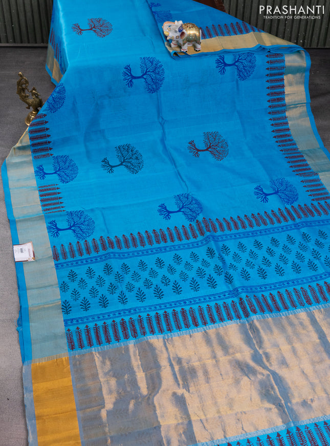 Silk cotton block printed saree light blue with allover prints and zari woven border