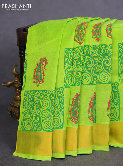 Silk cotton block printed saree fluorescent green with allover prints and zari woven border