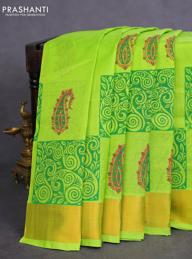 Silk cotton block printed saree fluorescent green with allover prints and zari woven border