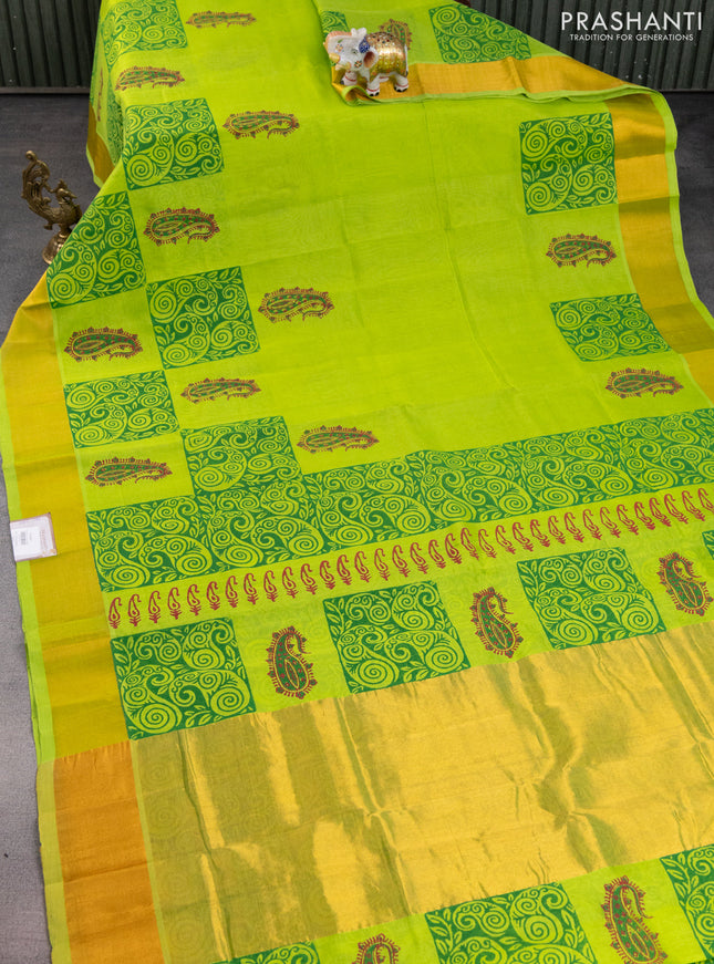 Silk cotton block printed saree fluorescent green with allover prints and zari woven border
