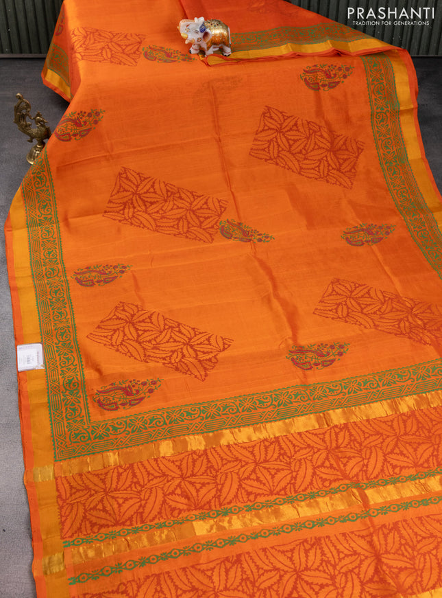 Silk cotton block printed saree orange with butta prints and zari woven border