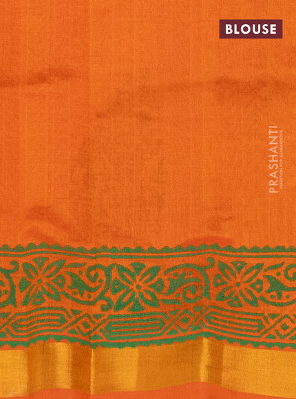 Silk cotton block printed saree orange with butta prints and zari woven border