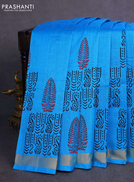 Silk cotton block printed saree light blue with allover prints and zari woven border