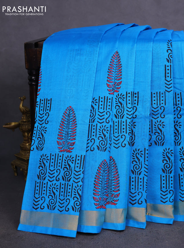 Silk cotton block printed saree light blue with allover prints and zari woven border