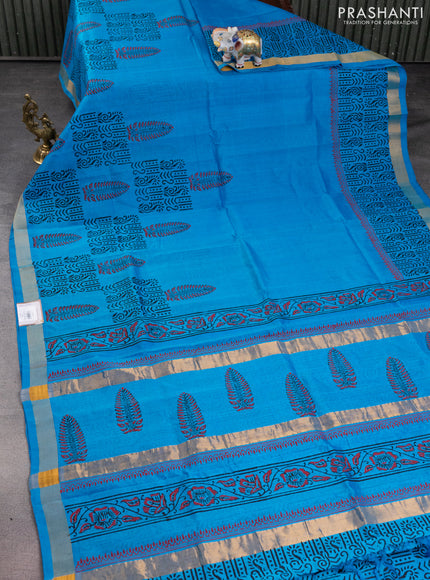 Silk cotton block printed saree light blue with allover prints and zari woven border