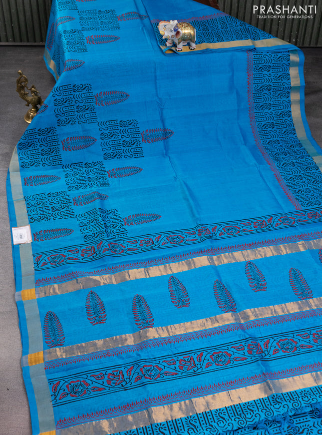 Silk cotton block printed saree light blue with allover prints and zari woven border