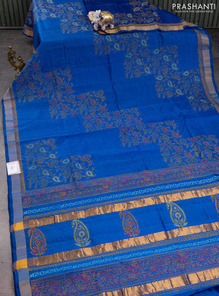 Silk cotton block printed saree cs blue with allover prints and zari woven border
