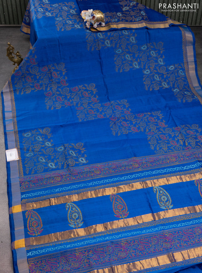 Silk cotton block printed saree cs blue with allover prints and zari woven border