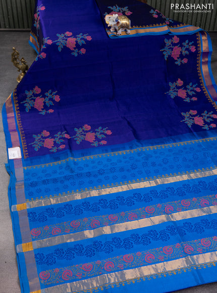 Silk cotton block printed saree blue and cs blue with allover floral prints and zari woven border