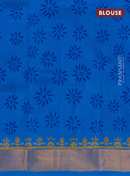 Silk cotton block printed saree blue and cs blue with allover floral prints and zari woven border