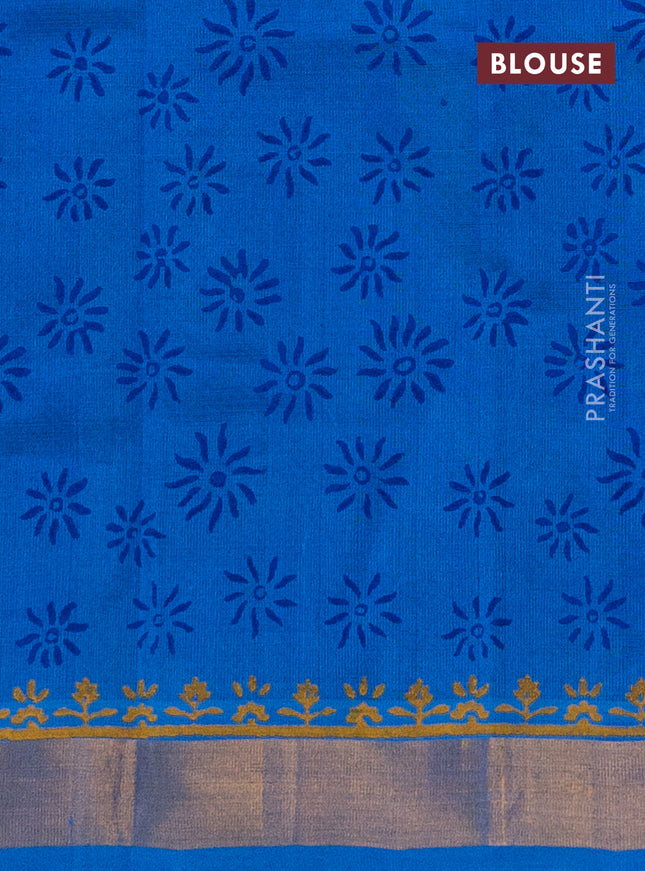 Silk cotton block printed saree blue and cs blue with allover floral prints and zari woven border