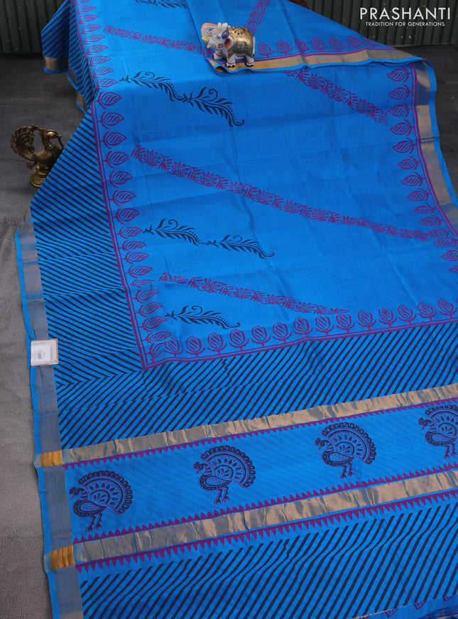 Silk cotton block printed saree cs blue with butta prints and zari woven border