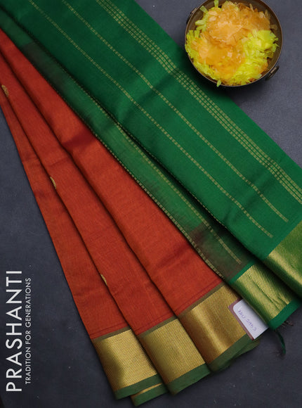 Silk cotton saree rust shade and green with zari woven buttas and zari woven border