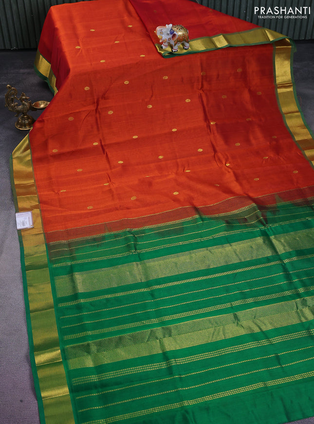Silk cotton saree rust shade and green with zari woven buttas and zari woven border