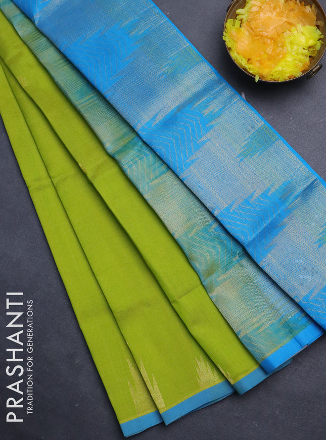 Silk cotton saree light green and cs blue with zari woven buttas and temple design zari woven border