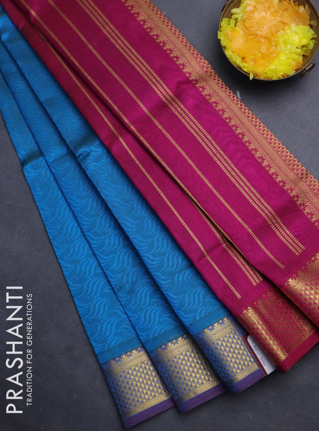 Silk cotton saree dual shade of cs blue and magenta pink with allover self emboss jacquard and zari woven border