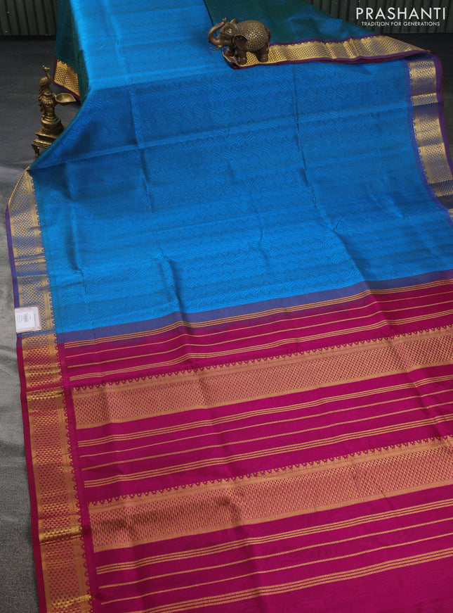 Silk cotton saree dual shade of cs blue and magenta pink with allover self emboss jacquard and zari woven border