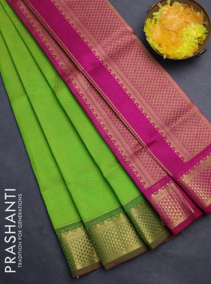 Silk cotton saree light green and magenta pink with allover self emboss jacquard and zari woven border