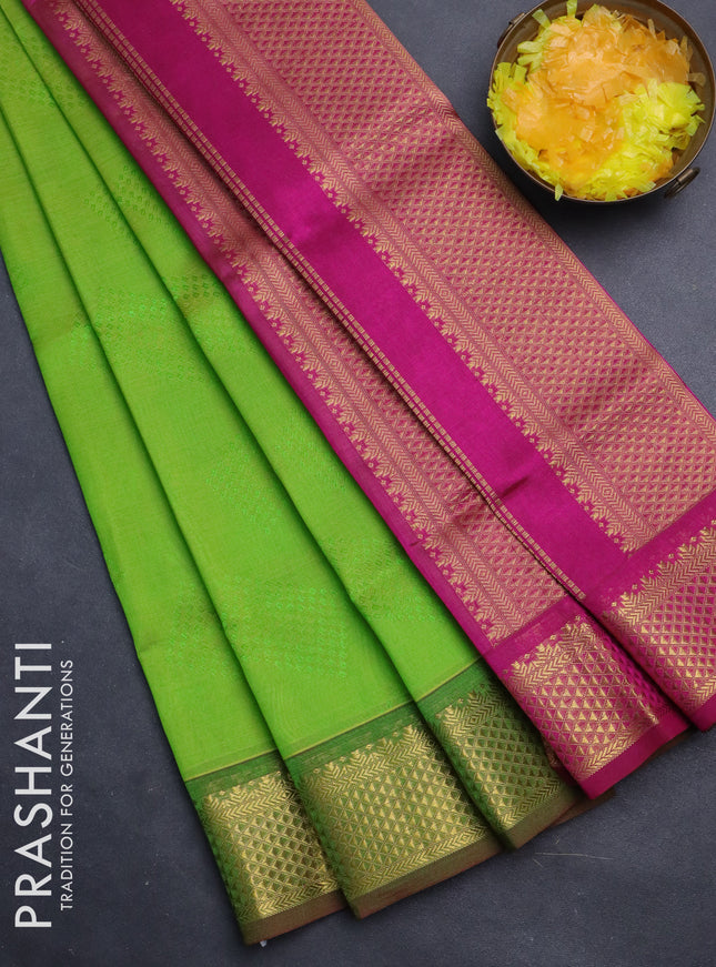 Silk cotton saree light green and magenta pink with allover self emboss jacquard and zari woven border