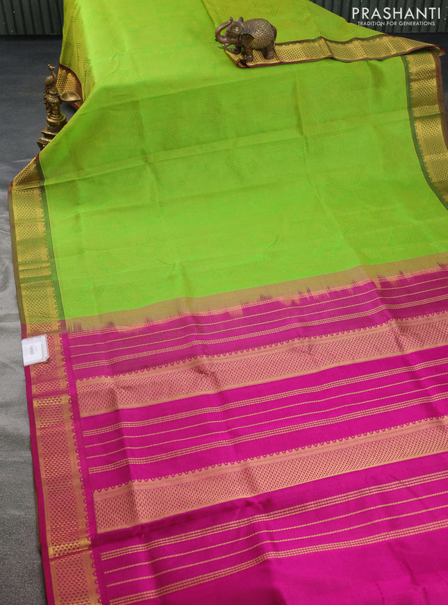 Silk cotton saree light green and magenta pink with allover self emboss jacquard and zari woven border