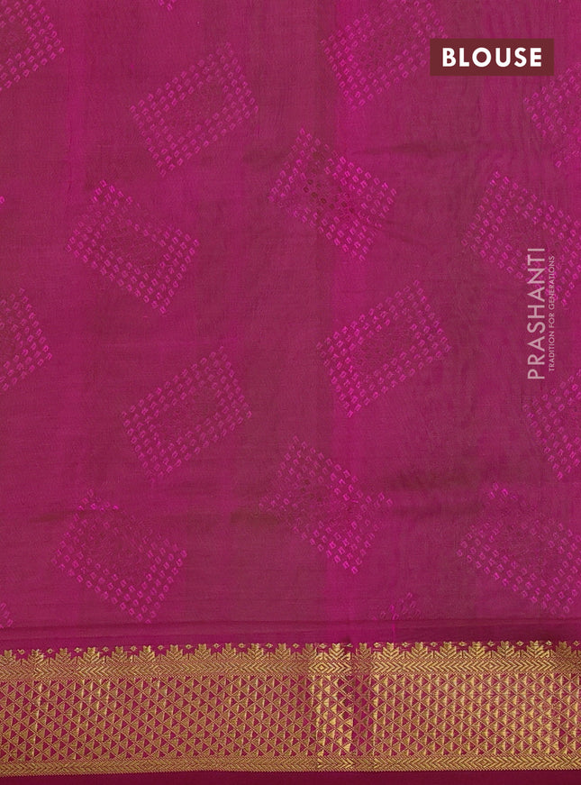 Silk cotton saree light green and magenta pink with allover self emboss jacquard and zari woven border