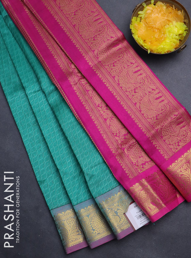 Silk cotton saree teal green and pink with allover self emboss jacquard and annam zari woven border