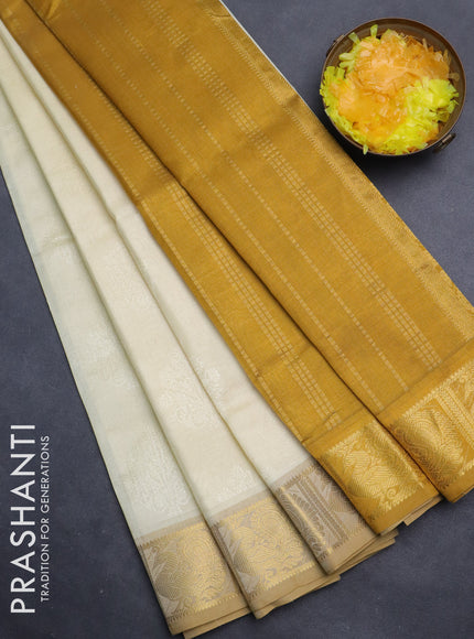 Silk cotton saree cream and mustard yellow with allover self emboss jacquard and annam zari woven border