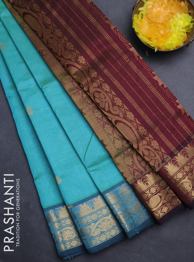 Silk cotton saree dual shade of teal blue and wine shade with allover vairaosi pattern & zari buttas and temple design zari woven border