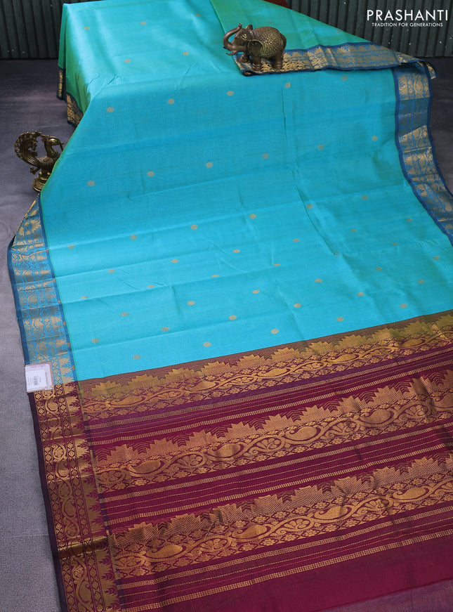 Silk cotton saree dual shade of teal blue and wine shade with allover vairaosi pattern & zari buttas and temple design zari woven border