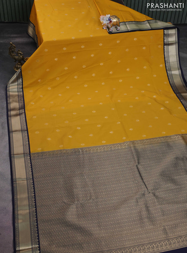 Semi kanchipuram silk saree mustard yellow and navy blue with zari woven buttas and zari woven korvai border