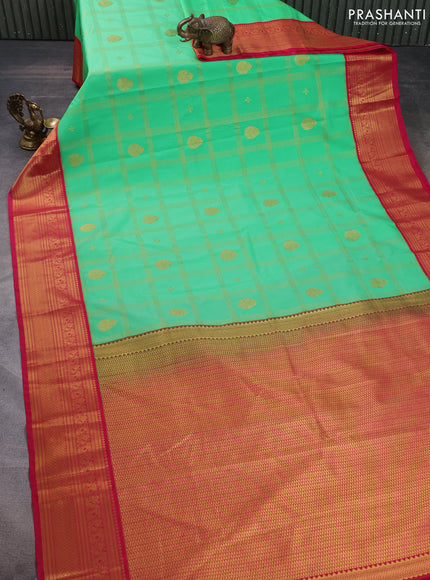 Semi kanchipuram silk saree teal green and pink with allover zari checks & buttas and rich zari woven korvai border
