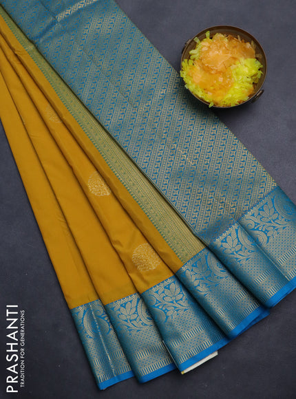 Semi kanchipuram silk saree mustard yellow and cs blue with zari woven buttas and zari woven korvai border