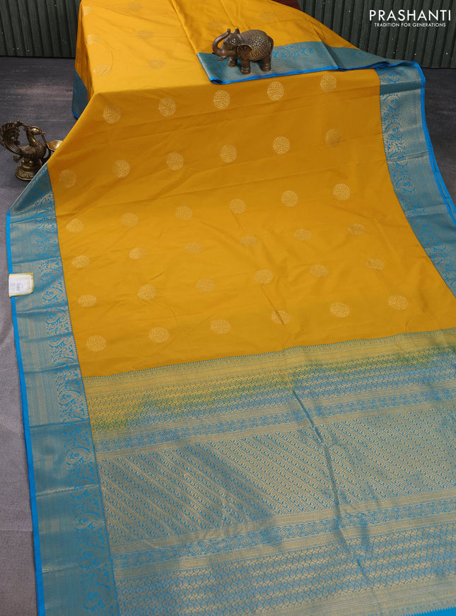 Semi kanchipuram silk saree mustard yellow and cs blue with zari woven buttas and zari woven korvai border