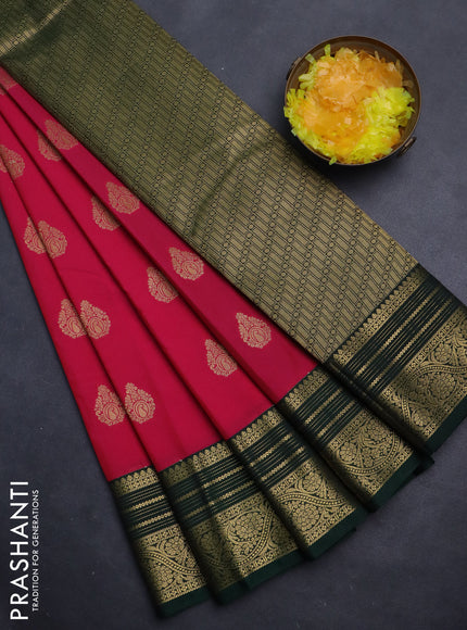Semi kanchipuram silk saree pink and dark green with zari woven floral buttas and zari woven korvai border
