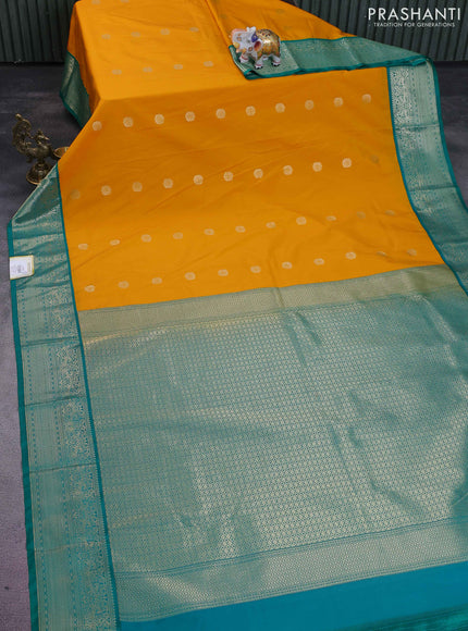Semi kanchipuram silk saree mango yellow and teal green with zari woven buttas and rich zari woven korvai border