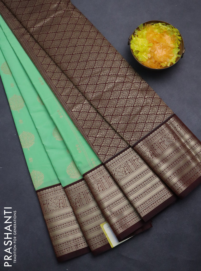 Semi kanchipuram silk saree teal green shade and deep maroon with allover zari weaves & buttas and zari woven korvai border