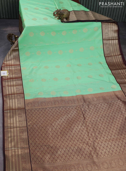 Semi kanchipuram silk saree teal green shade and deep maroon with allover zari weaves & buttas and zari woven korvai border