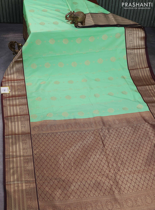 Semi kanchipuram silk saree teal green shade and deep maroon with allover zari weaves & buttas and zari woven korvai border