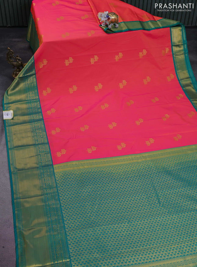 Semi kanchipuram silk saree dual shade of pinkish yellow and teal green with zari woven buttas and long rich zari woven korvai border