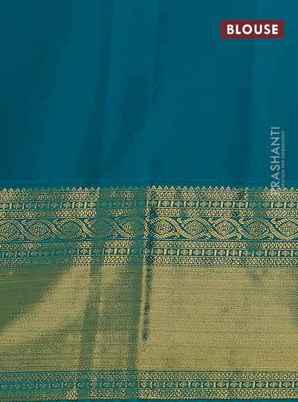 Semi kanchipuram silk saree dual shade of pinkish yellow and teal green with zari woven buttas and long rich zari woven korvai border