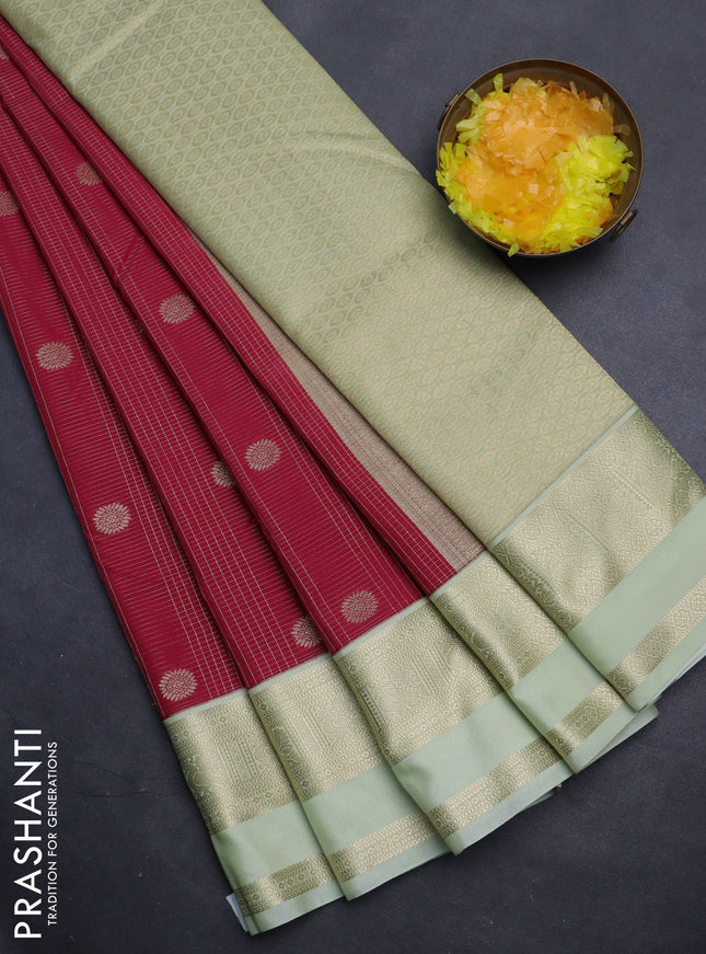 Semi kanchipuram silk saree dark pink and mild pista green with allover zari checks & buttas and rettapet zari woven korvai border