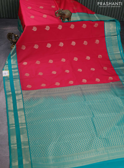 Semi kanchipuram silk saree tomato pink and teal green with zari woven buttas and rettapet zari woven korvai border