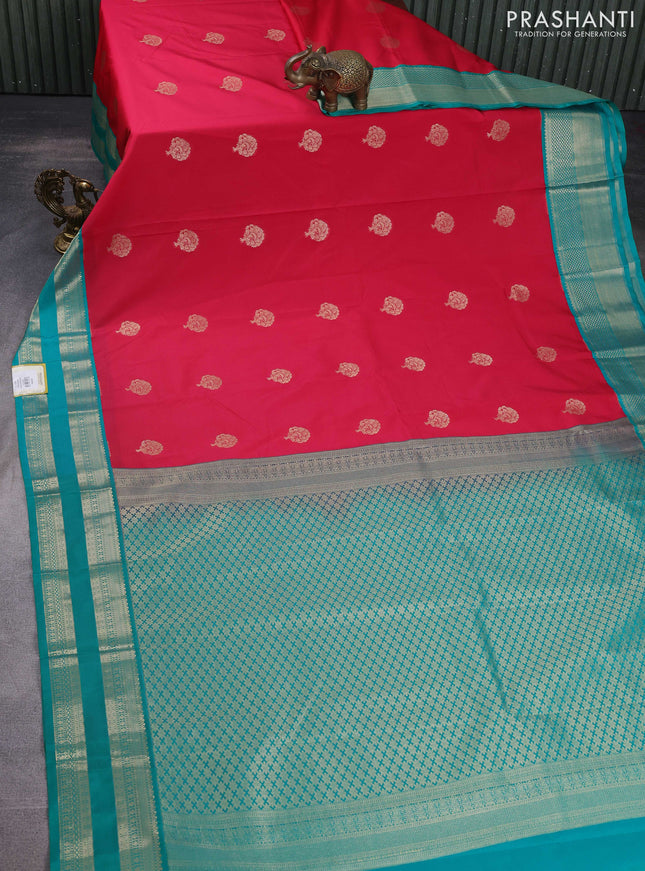 Semi kanchipuram silk saree tomato pink and teal green with zari woven buttas and rettapet zari woven korvai border
