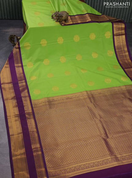 Semi kanchipuram silk saree green and purple with zari woven buttas and long rettapet zari woven korvai border