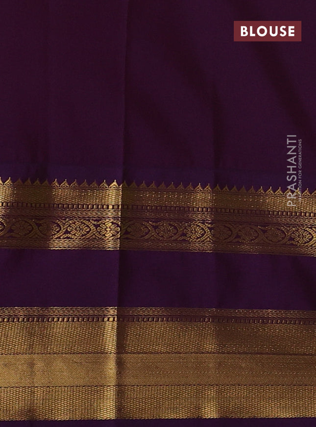 Semi kanchipuram silk saree green and purple with zari woven buttas and long rettapet zari woven korvai border
